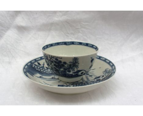An 18th century Worcester blue and white tea bowl and saucer painted in The Rock Strata Island pattern, underglaze open "C" m