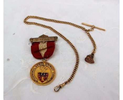 A 9ct yellow gold Albert chain together with a heart shaped fob seal, approximately 21 grams and an 18ct yellow gold medallio
