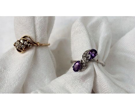 An amethyst and diamond ring set to a 9ct white gold setting and shank together with a 9ct yellow gold cluster ring