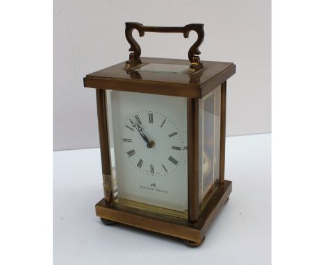 A Matthew Norman carriage clock with a brass case, the enamel dial with Roman numerals inscribed, striking on a gong, 17.5cm 