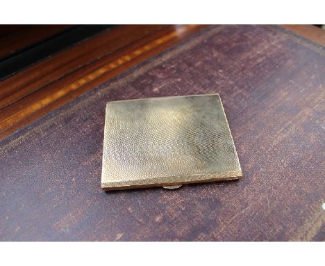 A 9ct yellow gold cigarette case with engine turned decoration, approximately 130 grams