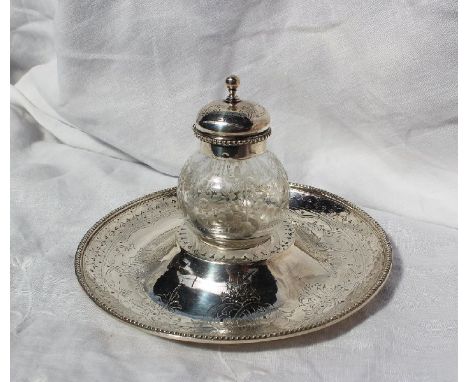 A Victorian silver inkwell, the central removable well of globe form engraved with swags, the base of circular form engraved 