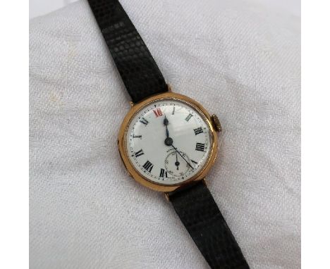 A 9ct yellow gold mid size wristwatch, the enamel dial with Roman numerals and a seconds subsidiary dial inscribed Zenith on 