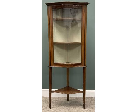 EDWARDIAN CROSSBANDED MAHOGANY FLOOR STANDING DISPLAY CABINET, serpentine front and door glass, single opening upper door, fa