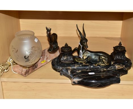 AN ART DECO STYLE BLACK VARIEGATED MARBLE DESK STAND AND A TABLE LAMP, the desk stand with a pair of covered bronzed inkwells