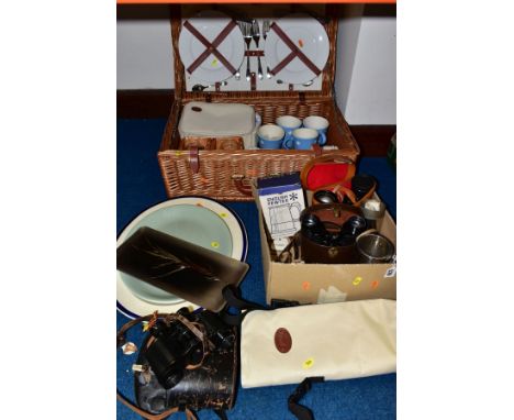 A BOX OF BINOCULARS, ETC AND LOOSE, comprising an Optima wicker picnic basket containing a set of mugs, wine glasses, plates,