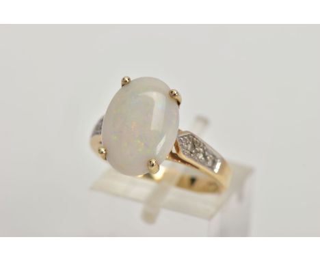 A 9CT GOLD OPAL AND DIAMOND DRESS RING, four claw set white opal cabochon showing flashes of blue, green, red and yellow, opa