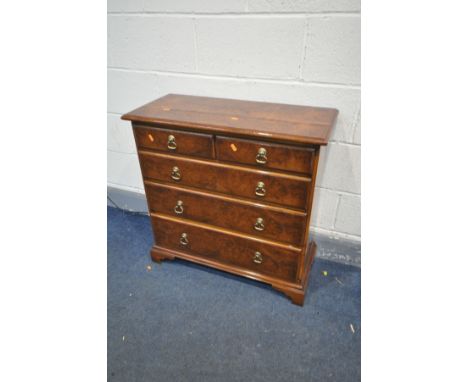 A REPRODUCTION WALNUT TV CABINET, a rise and fall tv bracket, fitted with a Samsung LE23R87BD 23inch lcd tv (PAT pass and wor