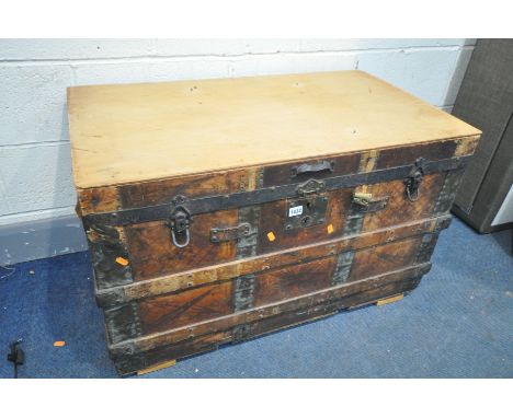 A VINTAGE STORAGE TRUNK, with leather and wooden banding, width 92cm x depth 55cm x height 58cm (condition:-ideal for restora