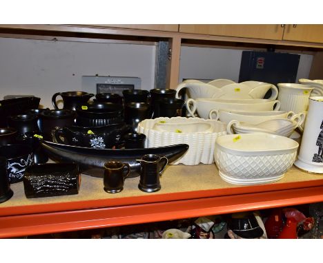A QUANTITY OF SYLVAC POTTERY, comprising twenty one black and pewter effect tankards, household novelties, planters, also twe
