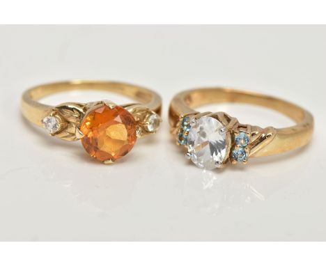 TWO 9CT GOLD GEM SET DRESS RINGS, the first centring on a four claw set, circular cut citrine, flanked with textured shoulder