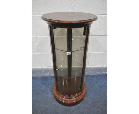 A LATE 20TH CENTURY MAHOGANY CYLINDRICAL DISPLAY CABINET, with domed glass panel, and two glass shelves, diameter 42cm x heig