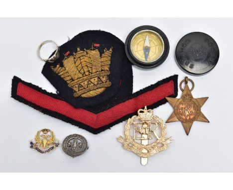 A SELECTION OF SILVER AND YELLOW METAL MAINLY MILITARY ITEMS, to include a yellow metal doubled headed phoenix brooch decorat