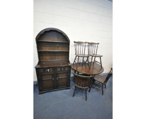 AN OAK GATE LEG TABLE, open length 119cm x closed length 44cm x depth 120cm x height 74cm, four chairs, and a Dutch dresser w