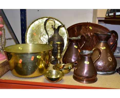 A QUANTITY OF BRASS AND COPPERWARE, comprising of  three Georgian copper measuring jugs (quart, half gallon, gallon), a 'Hugh