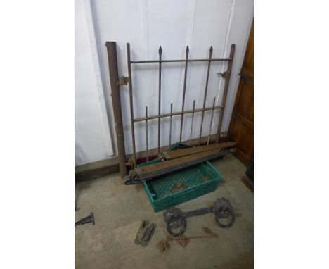 A vintage iron gate with brackets, etc. 