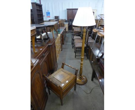 A carved oak standard lamp and a beech commode 
