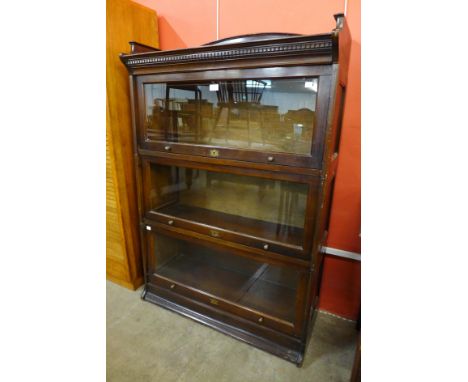 An early 20th Century Lebus oak three tier sectional stacking bookcase 