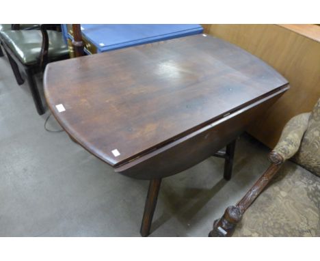 An Ercol Golden Dawn elm and beech drop-leaf table 