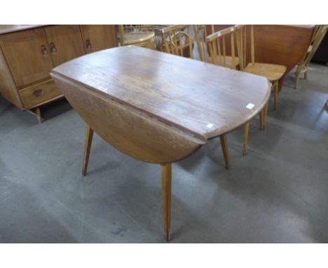 An Ercol Blonde elm and beech Windsor drop-leaf table 