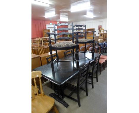 An Ercol dark elm eight piece dining suite 