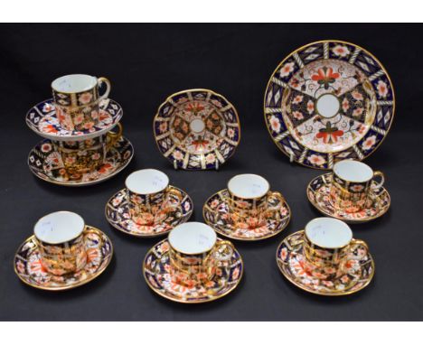 A set of six Royal Crown Derby 2451 pattern coffee cans and saucers; a similar side plate; a 2451 pattern shaped square dish;