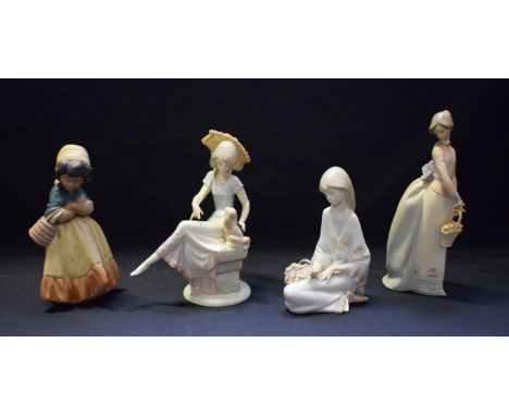 A Lladro ceramic figure, Picture Perfect, 7612; others, Basket Of Love, Flowers Song, etc (4)