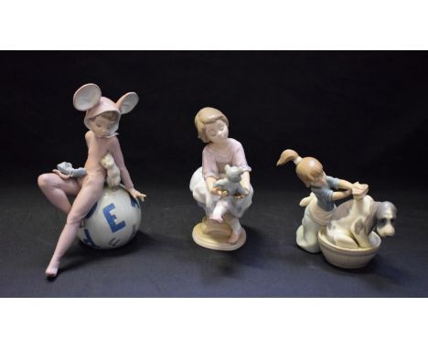 A Lladro ceramic figure, Restful Mouse, 5882; others, Bashful Bather, Best Friend (3)