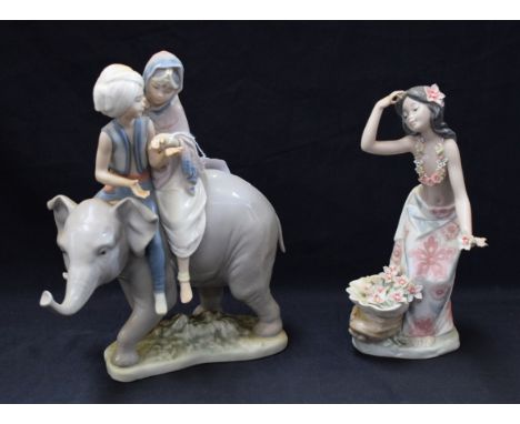 A Lladro ceramic figure group, Hindu Children on Elephant, 5352, 22.5cm high; another, Aloha (2)