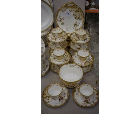 A late Victorian Crescent China part tea service, for twelve, including cups, saucers, cake plates; etc all transfer printed 