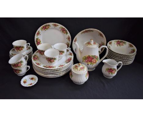 A Royal China English Rose pattern dinner and tea service, for eight, comprising dinner plates, side plates, bowls, teapot, c