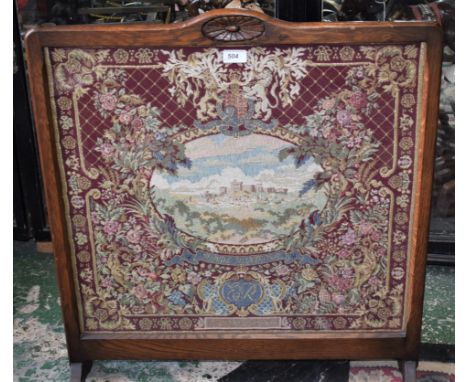 A mid 20th century oak framed tapestry firescreen, the Coronation of Queen Elizabeth II, 1953