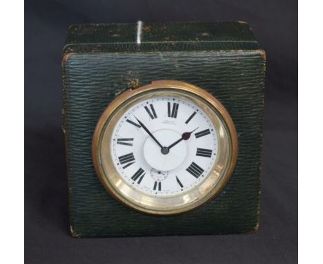 An unusual late 19th century green morocco leather travelling alarm clock, The Logic, 6.5cm enamel dial inscribed M &amp; Co 