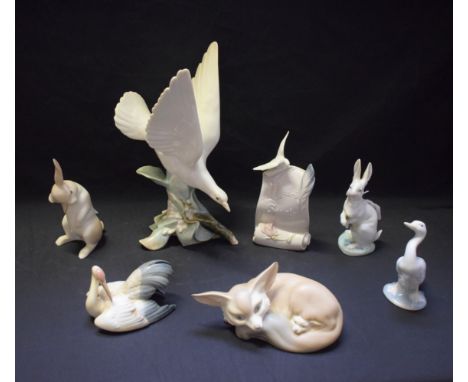 A Lladro ceramic model, Turtle Dove, 28cm high; others, Fox and Cub, Rabbit, Nesting Crane, etc