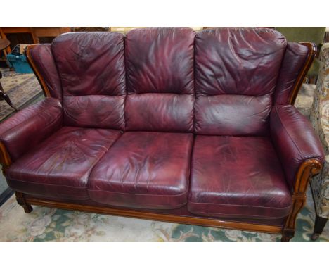 A 20th century hardwood framed scroll arm three seat sofa, 191cm wide