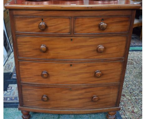 A Victorian mahogany bow fronted chest of two short over three long graduated cockbeaded drawers, bun feet, 103cm wide