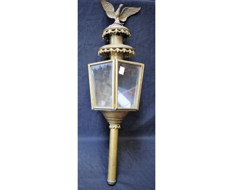 A 20th century brass carriage type lantern, crested by an Eagle, 64cm high