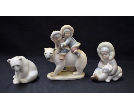 A Lladro ceramic figure group, Eskimo Riders, 5353; others, Boy with Polar Bear, Polar Bear (3)