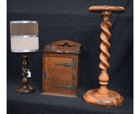 An oak smokers cabinet; a turned table lamp; a jardiniere stand (3)