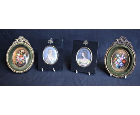 A pair of early 19th century printed portrait miniatures, ebonised frames, acorn hanging loops; a pair of Italian oval miniat