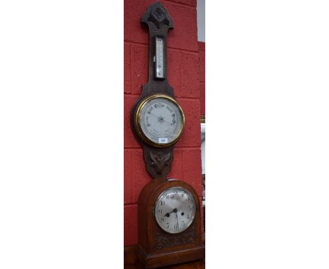 An early 20th century oak wheel barometer; an oak mantel clock, c.1930 (2)