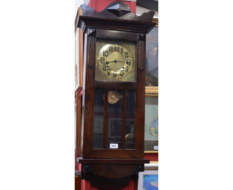 A 20th century oak cased wall clock, Arts and Crafts brass dial, Arabic numerals, shaped case; a Westminster chiming mantel c