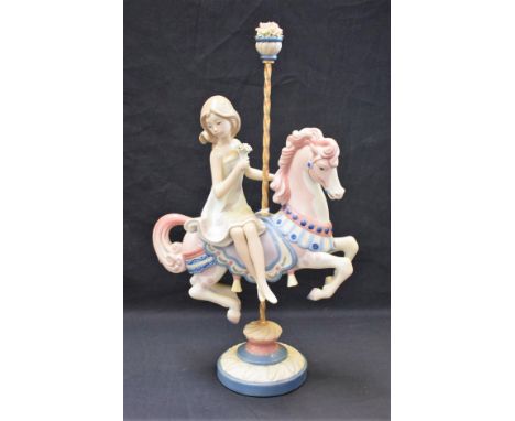 A Lladro ceramic figure, Girl on a Carousel Horse, 39cm high