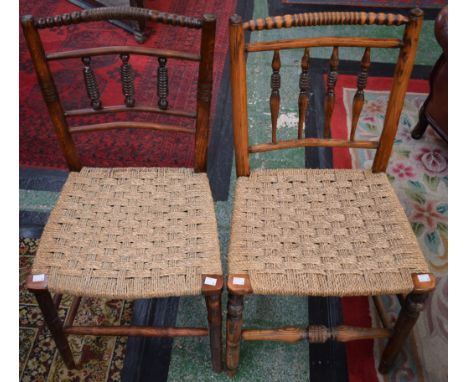 A near pair of rush seated country side chairs, bobbin turned cresting rails (2)