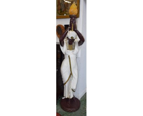 A 20th century composite figural floor standing lamp, as Cleopatra holding aloft a flaming torch, 191cm high