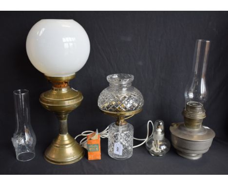 Lighting - a cut glass table lamp; a brass paraffin/oil lamp; etc (4)