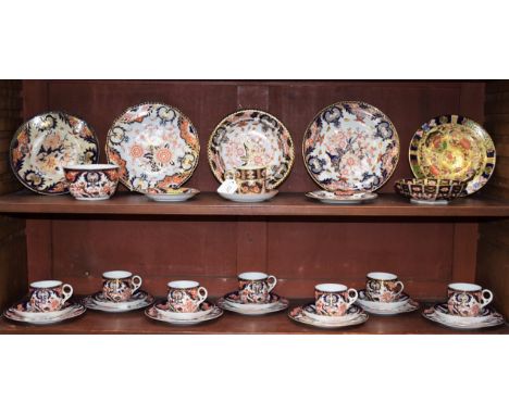 A set of seven Royal Crown Derby 383 pattern Imari teacups and saucers, slop bowl, side plates, muffin dish, etc; a similar o