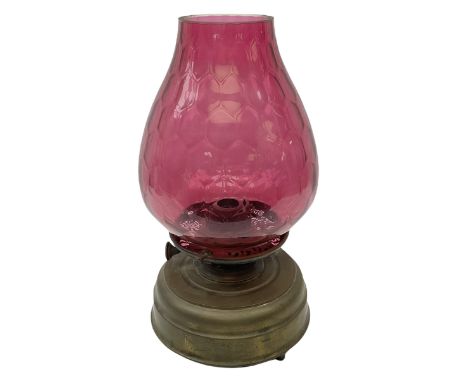 20th century brass oil lamp, with large honeycomb cranberry glass shade, H44cm