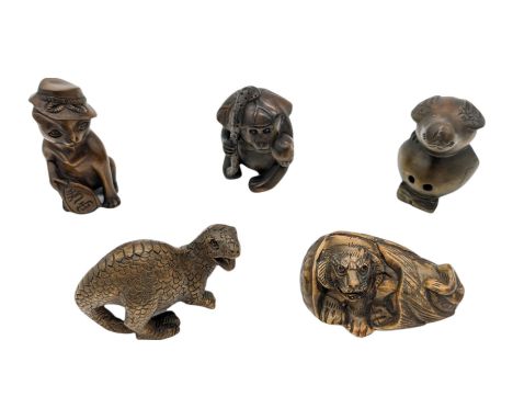 Five netsuke, modelled as a monkey, bird, tiger, lizard and a cat in a hat
