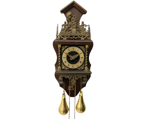 20th century Dutch style Zaanse Zaandam wall clock with a German eight-day weight driven movement housed in a wooden case on 